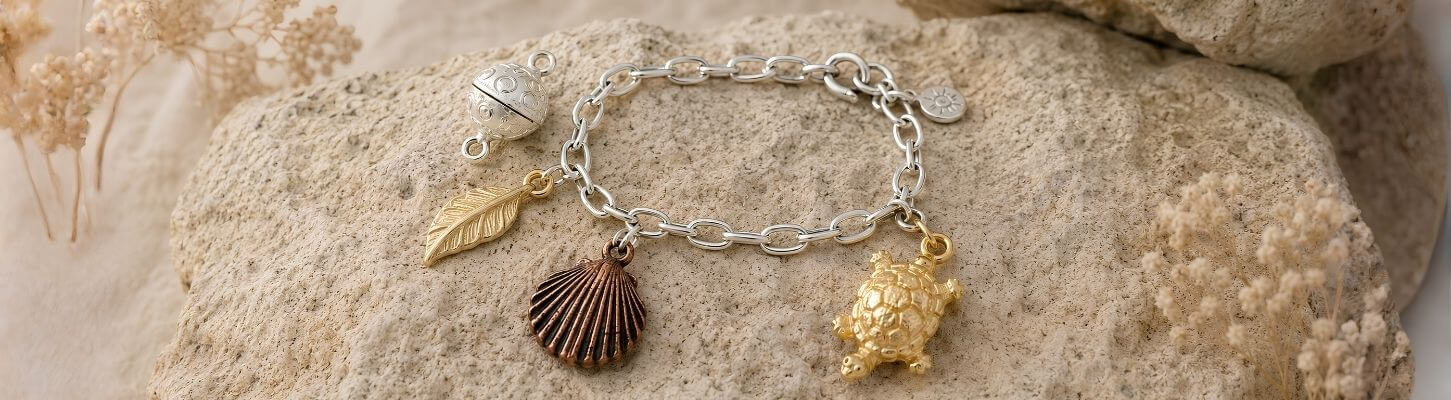 What Is a Charm Bracelet? A Guide to Meaning, History & Symbols - Atlanta Findings
